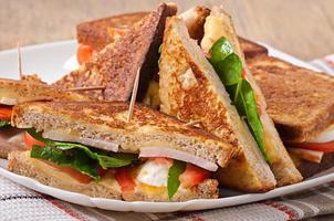 Club sandwich with chicken and ham photo