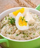 Wheat porridge with herbs photo