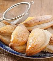 Cookies with cottage cheese sprinkled with powdered sugar photo