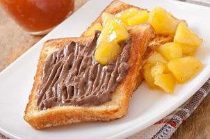 French toast with caramelized apples and chocolate cream for breakfast photo