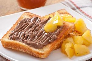 French toast with caramelized apples and chocolate cream for breakfast photo