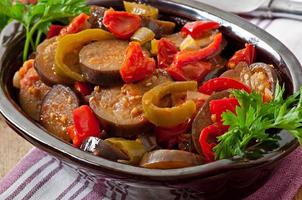 Steamed vegetables - eggplant, peppers and tomatoes photo
