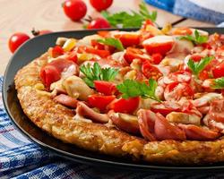 Potato gratin - pizza with sausage, mushrooms and tomatoes photo