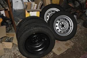 New tire with rubber on the iron disc of the car photo