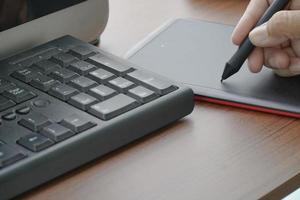 busy in creative task use digital graphic tablet and drawing photo