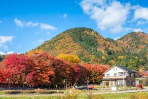 Dreaming house with maple tree corridor and rear mountain photo