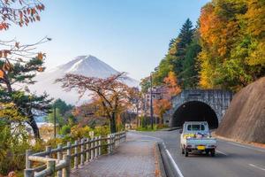Mount Fuji on lake with autumn garden on tunnel in Kawaguchiko lake photo