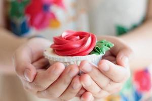 hand hold valentines cupcake photo