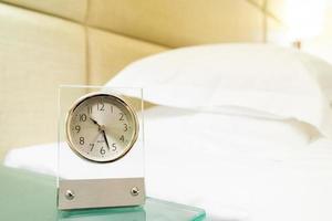 Old clock with dust on bedside table with copy space on right photo