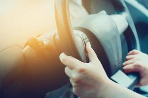 Female driving car photo