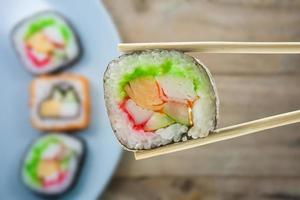 sushi with chopsticks photo