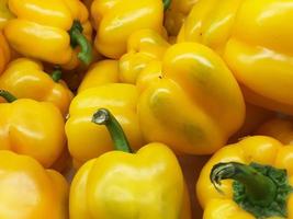 organic yellow bell peppers in market place