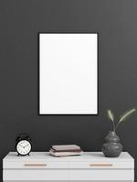 Minimalist vertical black poster or photo frame mockup on the wall with book and decoration