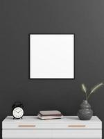 Minimalist square black poster or photo frame mockup on the wall with book and decoration
