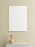 Minimalist vertical white poster or photo frame mockup on the wall in the living room with desk. 3d rendering.