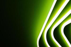 Abstract green light from a lamp on a black gray background. photo