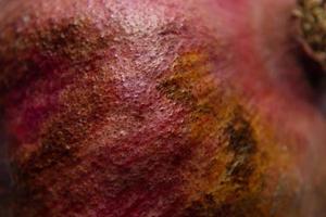 Ripe pomegranate peel. Selective focus. photo