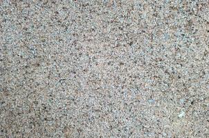 Background of small blue pebbles in a concrete solution. photo