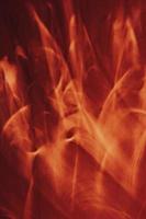 Bright red flames on black, abstract background. Vertical banner. photo