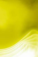 Bright yellow green olive vertical abstract background with white waves. Provides space for text. photo