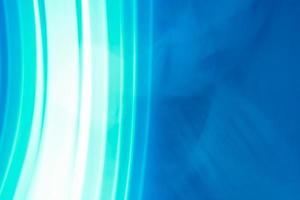 Horizontal blue abstract background with vertical highlights to white in the form of lines. photo