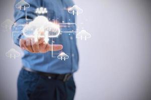 Technology business transformation data concept. Businessman touching virtual cloud computing to transfer database. information upload, download application. photo