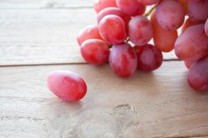 Grapes on a wooden table photo