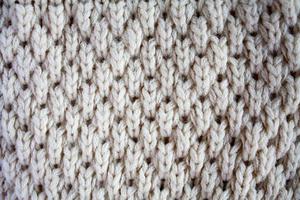 Close up on knit woolen fur texture photo