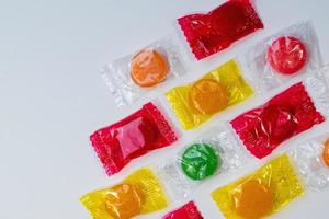 assorted hard candy in wrappers flat lay with copy space photo