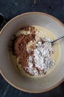 mixing bowl of ingredients for extra chocolate chip cookies flat lay photo