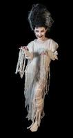 studio shot portrait of young girl in costume dressed as a Halloween, cosplay of scary bride of Frankenstein pose on isolated black background photo