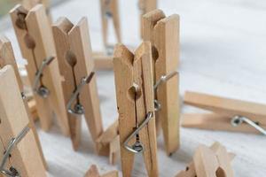 clothespins as concept people in a group with singled out figure photo