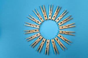 clothespins on vibrant blue in circle pattern