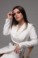 Studio waist up portrait of a beautiful businesswoman photo