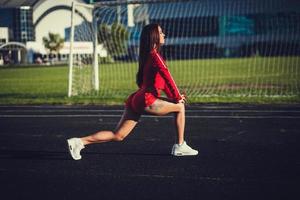 Young sportswoman outdoors photo
