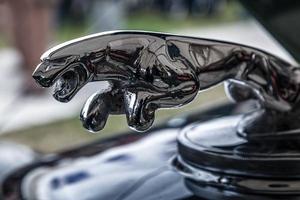 Goodwood, UK, 2012. Close-up of an old Jaguar automobile emblem