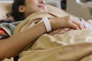 Woman patient lying on the hospital bed. photo