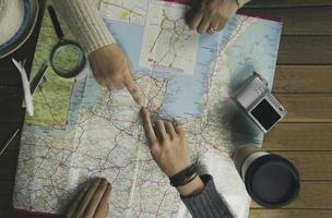 Top view travelers planning in holidays for vacation trip with map , Travel concept background