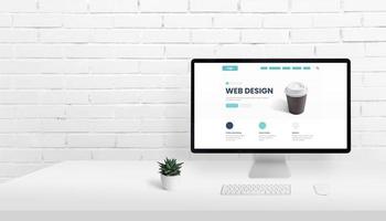 Web design homepage concept on computer display with copy space beside photo