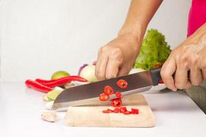 the way of hold knife and chop vegetable , kitchen tips photo