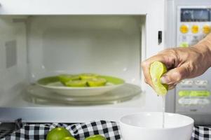 microwaving lemons for 20 to 30 seconds before squeeze make them soft and easily squeeze, kitchen tips photo