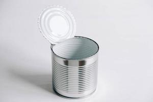 Empty open tin can on a white background photo