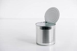 Empty open tin can on a white background