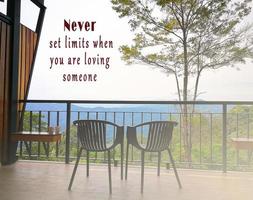 Motivational quote on image of couple chair and view from the balcony