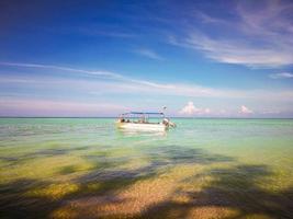 Travel destination, Malaysia. Flag of Sabah on sailing boat Mantanani Island photo