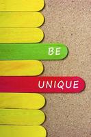 Motivational and inspirational quote on colorful wooden stick. photo