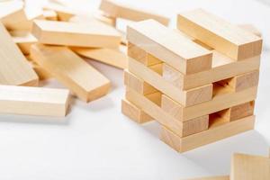 jenga on white background, wooden rectangles for the game