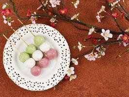 Sanshoku Dango Japanese Mochi, Pink, White, and Green Colored Dumplings. Three Colored Cherry Blossom Hanami Dango Traditional Japan Sweet photo