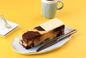 Marble Travel Cake, Mini Loaf Marble Cake with Melted Chocolate Inside. Also Known as Tube Cake. Served on White Plate photo