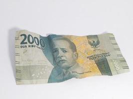 Indonesian money, 2000 banknotes isolated on a white background photo